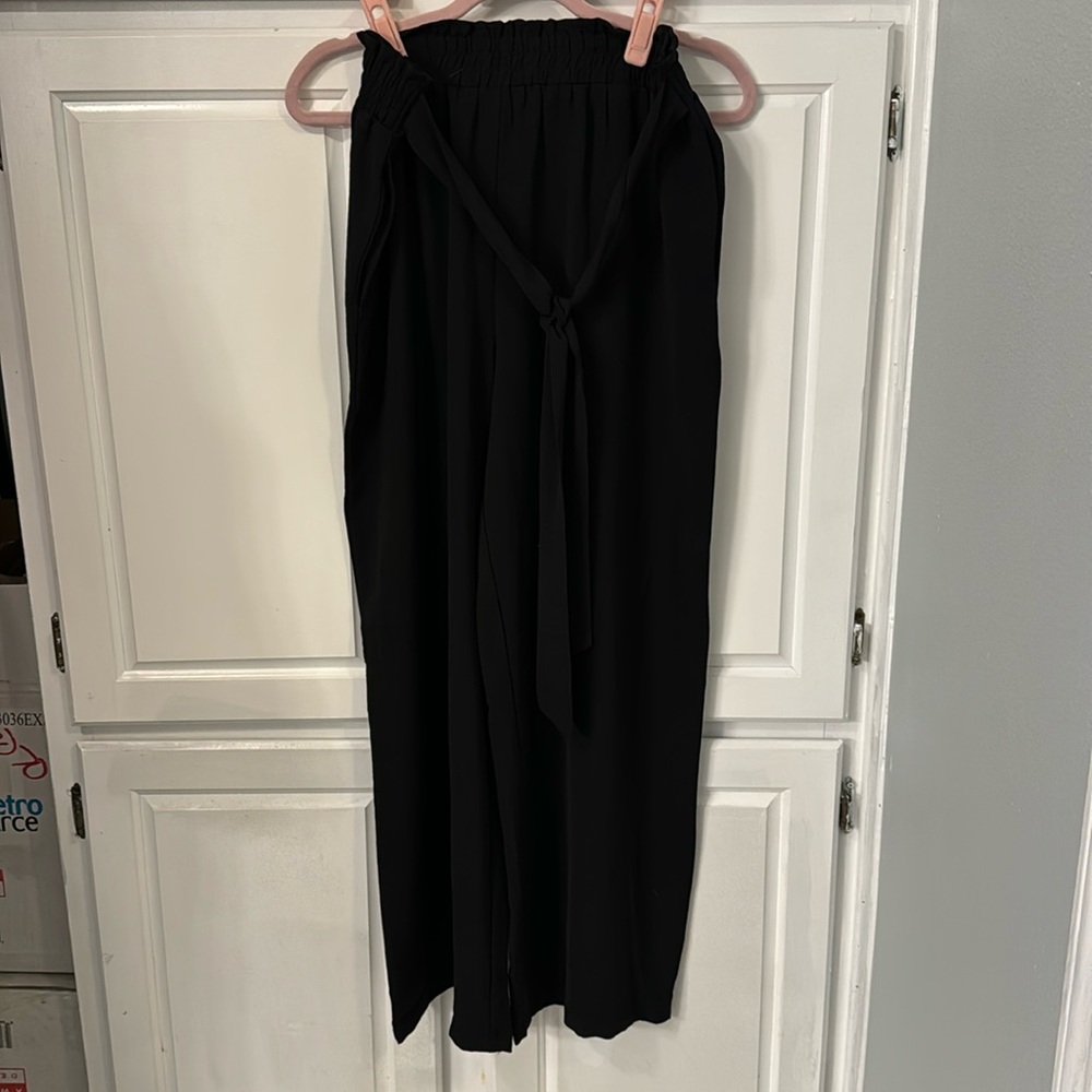 Black palazzo pants with elastic waist, tie in the front and pockets